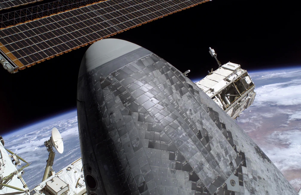 Ceramic thermal protection tiles on a space shuttle, crucial for atmospheric reentry.
