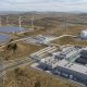 Hybrid solar and wind facility routing renewable electricity between Bitcoin mining and computing infrastructure, green hydrogen production, and the power grid.