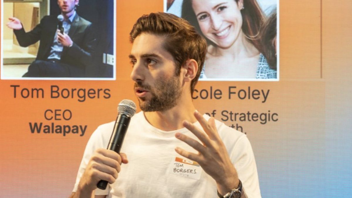 Tom Borgers, CEO and co-founder of Walapay, speaking at a conference